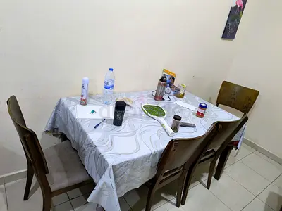 Wooden dining table with 6 chairs — good condition