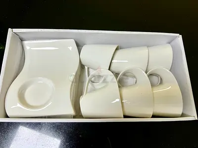 Set of 6 white ceramic espresso cups with matching saucers - like new