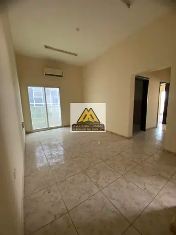Two-bedroom apartment with a living room | Al Rawda 3 | For annual rent | Excellent size | Close to all services | On the Dubai and Sharjah exit