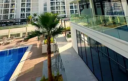 1 Bedroom | Azizi Riviera 61 | Balcony | City &amp; Pool Views