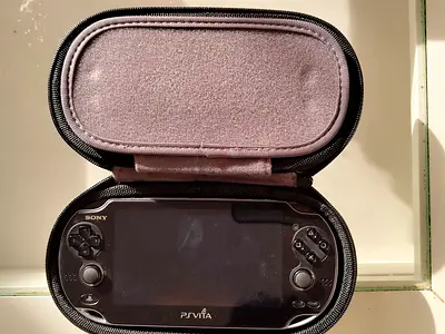 Sony PS Vita handheld console with protective case