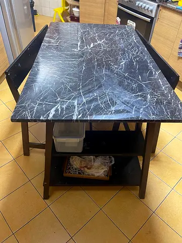Solid black marble-look kitchen island table with shelving