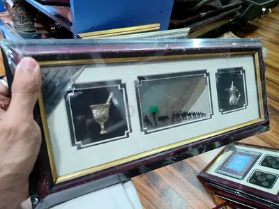 Framed Middle Eastern Decorative with seven sands and two symbols 39*18cm