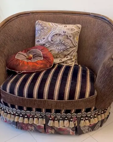 Vintage upholstered accent armcha with tassel trim
