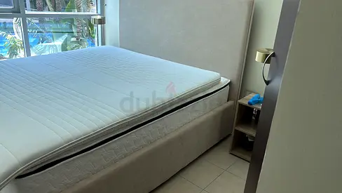 Light grey upholstered double bed frame with mattress - good condition