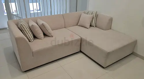 Light beige L-shaped fabric sectional sofa with chaise (4-seater) - good condition