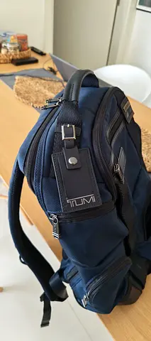 Tumi navy blue backpack in good condition