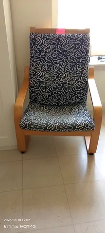 Light wooden armchair with patterned cushions - good condition for sure buyer negotiate the price
