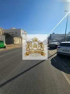 For sale in Sharjah, Al Hooshi area: Residential land plot, 10,000 sq ft, on an 18-meter paved road