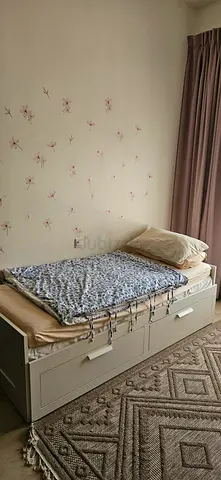 Single IKEA bed with built in storage