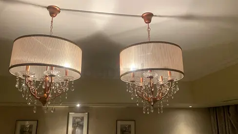 Pair of elegant chandeliers with crystal drops