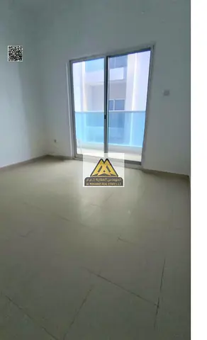 For rent: 1-bedroom apartment with hall in Al Nuaimiya 3, City Tower on Sheikh Khalifa Street, 2 bathrooms, balcony, central AC, free maintenance, AED