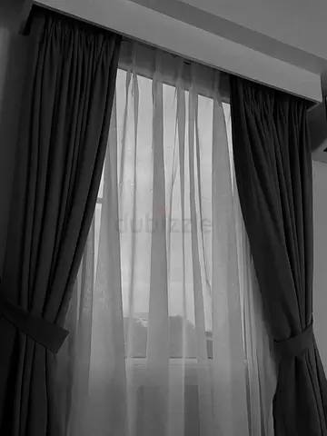 Pair of full-length blackout curtains with sheer liners