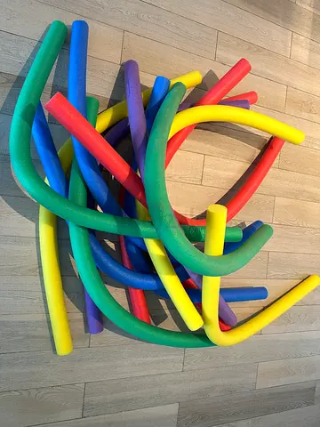 Bundle of colorful pool noodles — good condition, various lengths