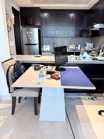 White Dining Table with four wooden chairs in Good Condition