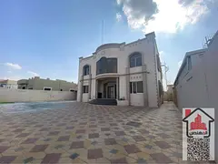 Two-story villa for rent in Ajman, Al Raqaib area. It consists of 5 bedrooms, a majlis (formal sitti