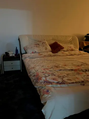 Queen upholstered bed frame with mattress and bedside table (used)