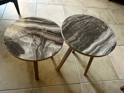 Pair of marble-effect round side tables with wooden legs