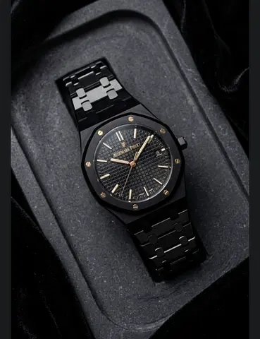 Black stainless steel men’s wristwatch with gold accents