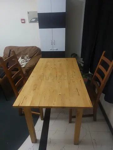 Solid Ikea wood dining table with 2 chairs - good condition