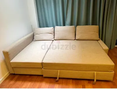 Beige L-shaped Sofa Bed with Storage - Good Condition