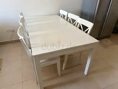 White extendable dining table with 6 chairs and two bar/ high chairs - good condition