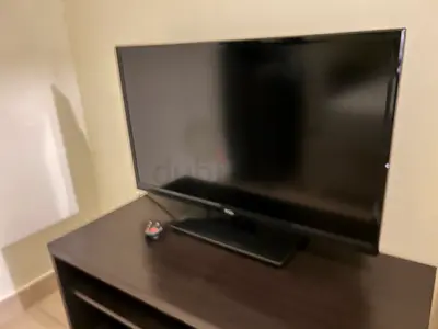 32-inch TCL LED TV in good working condition with free TV table