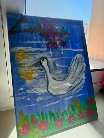 Hand-painted canvas of a white dove on blue background