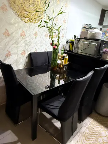 Modern Black Dining Table with Matching High-Back Chairs