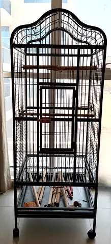 Large parrot/bird cage with wheels.