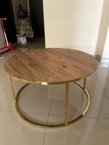Round wooden top coffee table with gold metal frame
