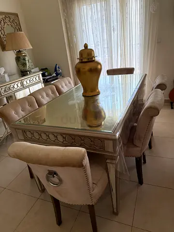 ‏dining table with chairs
