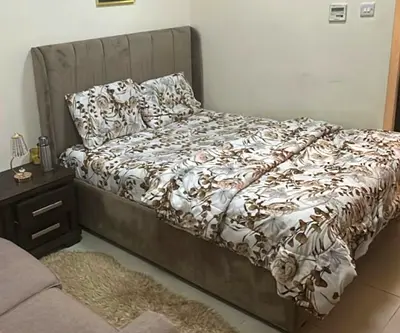 Queen bed headboard in beige velvet - like new