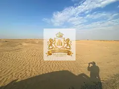 For sale in Sharjah Al Matraq area Residential investment plot, 3,608 square feet. Corner plot on tw