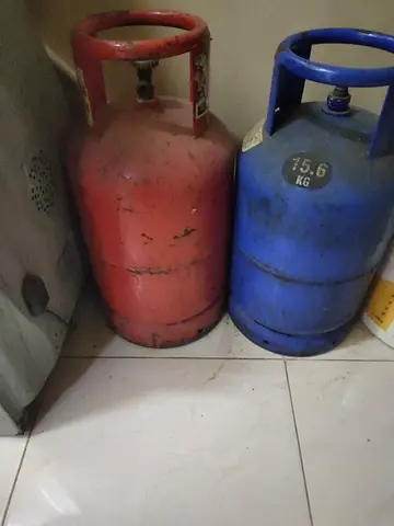 Two Used Gas Cylinders (15.6 kg) - Red and Blue