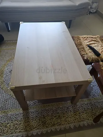 Light wood rectangular coffee table with storage shelf