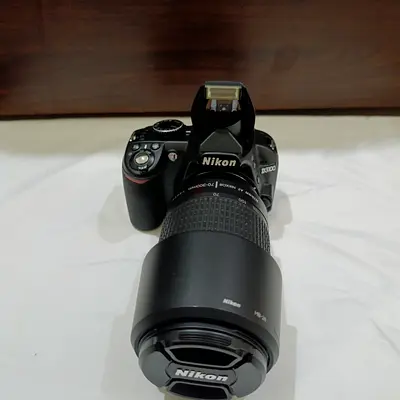 Nikon D3100 (shutter count is 3406)