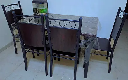 Dining table with 4 matching metal chairs - dark wood finish