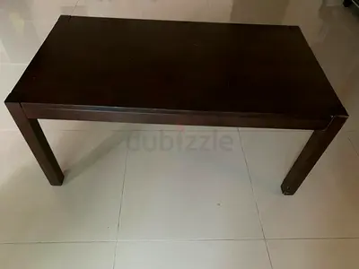 Solid dark wood coffee table - good condition