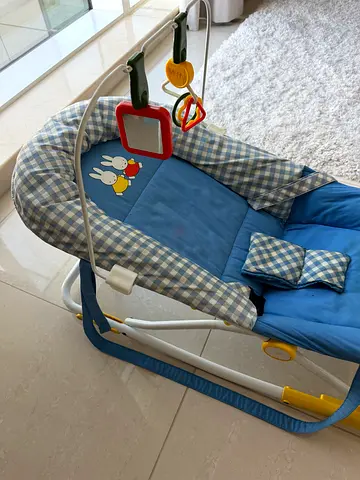 Blue baby rocker/bouncer with toy bar - good condition