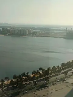 For annual rent | Al Khan Corniche, Sharjah ✨ Two-bedroom apartment with a living room and a stunn