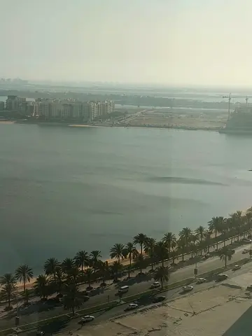 For annual rent | Al Khan Corniche, Sharjah ✨ Two-bedroom apartment with a living room and a stunn