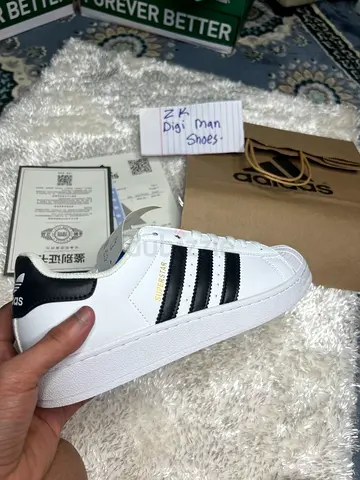 White Adidas Superstar sneakers with black stripes - size available 39-43