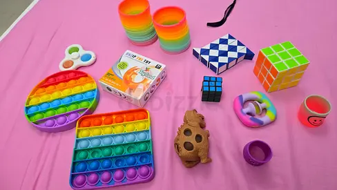 Mixed fidget toys bundle — pop it, slinky, puzzles  more