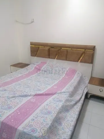 Wooden double bed frame with matching bedside tables - good condition