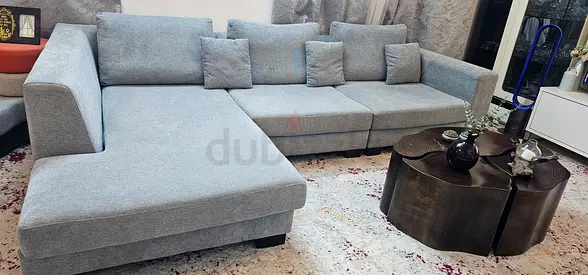 Light grey L-shaped fabric sofa with chaise - good condition