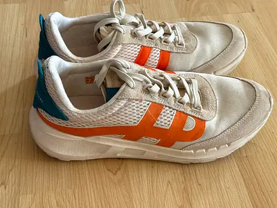 Hush Puppies White casual sneakers with orange stripes, size not specified