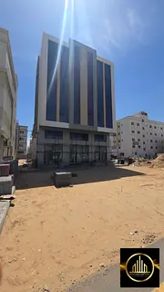 A brand new building for sale in Al-Aliya, Ajman. Directly on the main road.