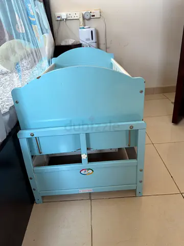 Light blue wooden baby cradle / bassinet in good condition