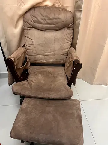 Brown suede reclining armchair with matching footstool